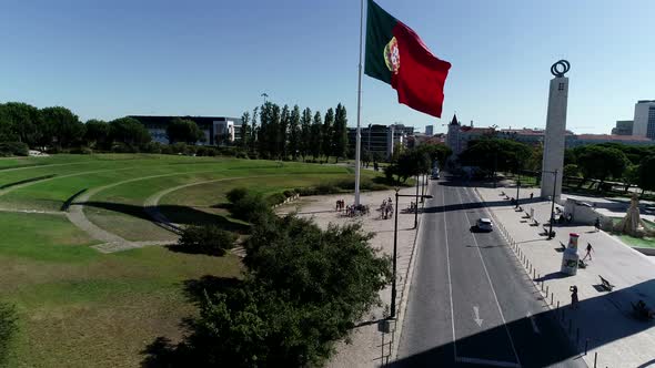 Aerial View of Portugal Flag Waving in the Wind on Eduardo VII Park Lisbon