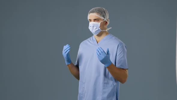 Young surgeon in scrubs