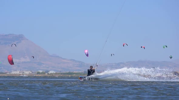 A man kiteboarding on a kite board.