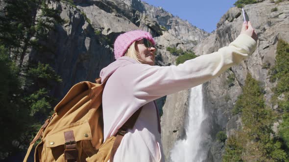 Yosemite Waterfall in National Park 6K Young Smiling Woman on Nature Adventure