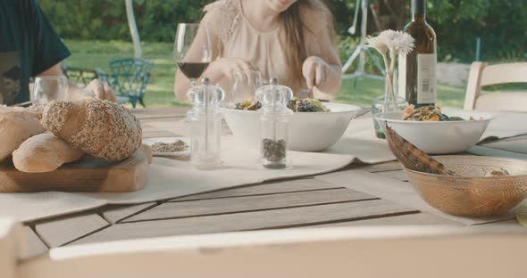 Slow motion of People sitting and eating meat in a lunch