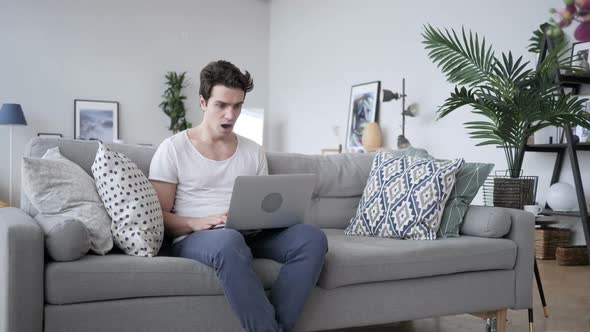 Shocked Stunned Man Working on Laptop