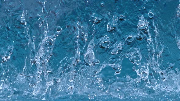 Super Slow Motion Shot of Ripping Blue Water Splash at 1000Fps
