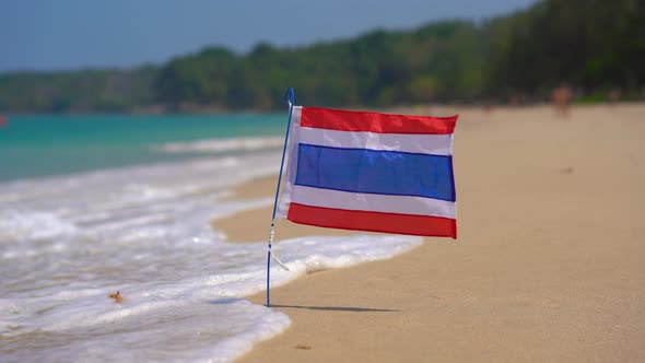 Closeup Shot of a National Flag of Thailand on a Beautiful Beach. Tropical Vacation Concept. Travel