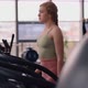 Woman Walking on a Treadmill in Gym - VideoHive Item for Sale