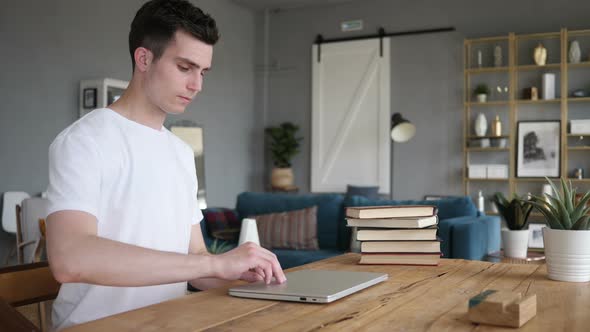 Casual Man Coming for Work on Laptop