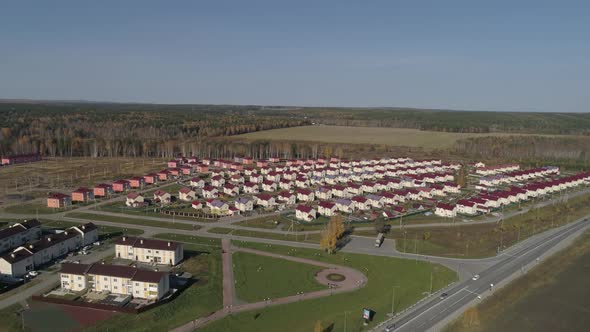 Aerial view of cottage village with identical houses 03