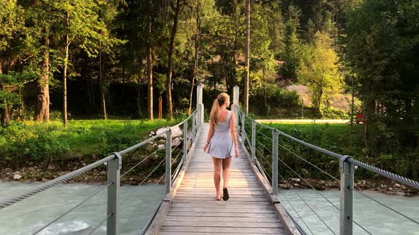 This is another 4k clip of the girl walking across the bridge