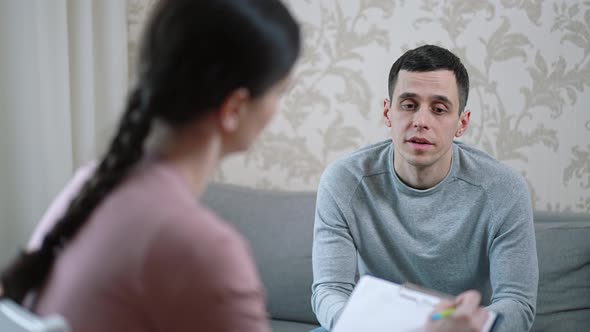 Man Talking with Psychologist