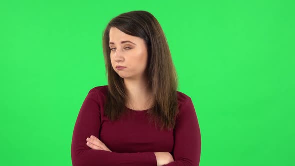 Portrait of Pretty Girl Is Very Offended Then Smiles, Green Screen