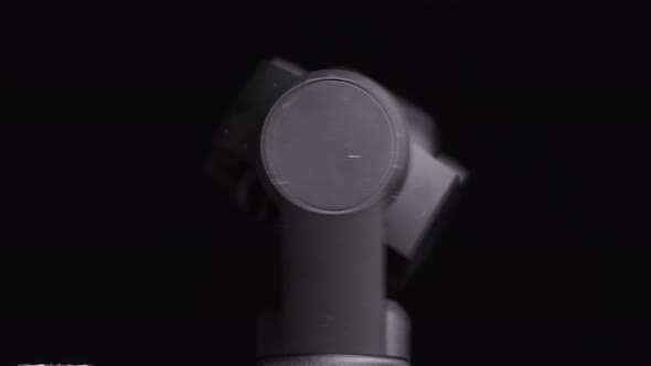 Mechanical Gimbal Camera Lens Rotates on Black Background Robotic Camera Macro