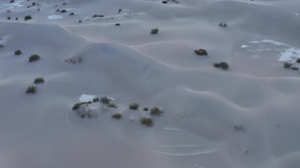 Camera tilts to reveal beautiful mountains in the desert. Death Valley, California. Aerial drone sho