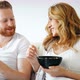 Happy Married Couple Being Romantic in Bed Sharing Cereal - VideoHive Item for Sale