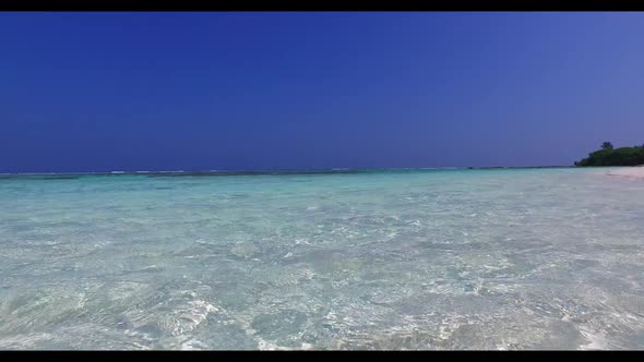 Aerial scenery of marine seashore beach adventure by blue lagoon with bright sandy background of a d