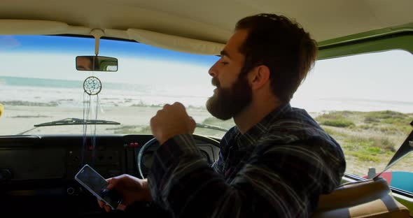 Young couple interacting with each other in the van 4k