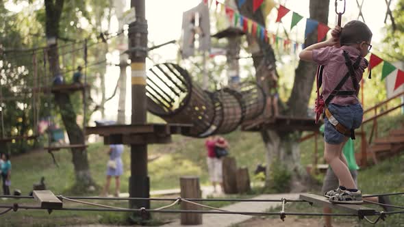 Boy Walk on a Rope Bridge at the Park