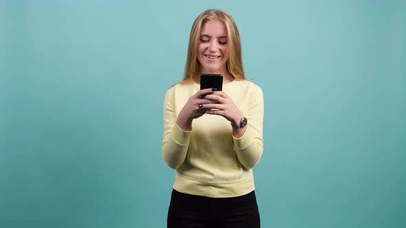 Young Happy Woman Using Smartphone