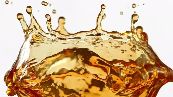 Super Slow Motion Shot of Brown Liquid Splash Isolated on White Background at 1000Fps.