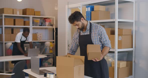 Young Manager in Post Room Packing Order for Distribution