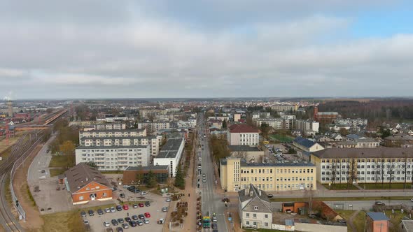 Mazeikiai City, Lithuania. Aerial View of Residential District, Street Traffic and Railway at Autumn