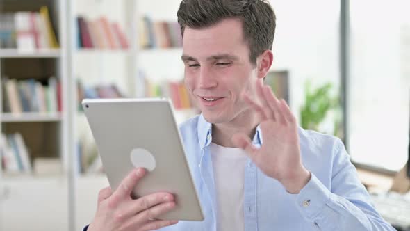 Online Video Chat on Tablet By Young Man