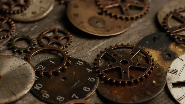 Rotating stock footage shot of antique and weathered watch faces 