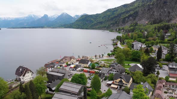 Aerial View of Mountain Lake Wolfgangsee with Houses of Resort Town in Austria, Alps