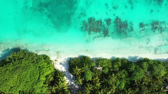 Aerial flying over panorama of luxury lagoon beach voyage by blue sea and white sand background of a