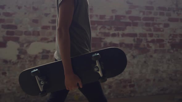 Fashionable young man in an abandoned warehouse