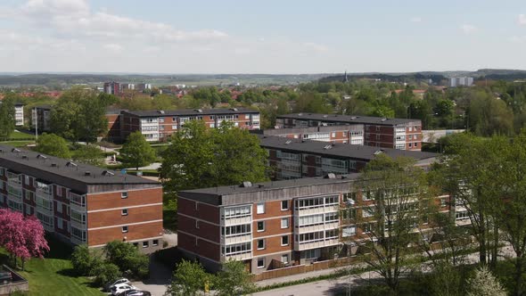 Modern living apartment buildings in Sweden city, aerial orbit view