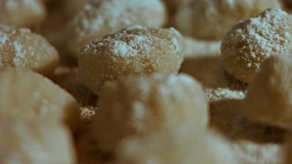 Chef Cutting Rolls of Potato Dough for the Preparation of Homemade Gnocchi Pleasant Atmosphere