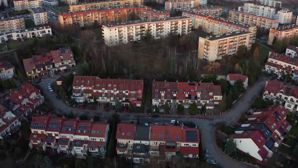 Solar Panels on the Roofs of Buildings in the Evening Aerial View