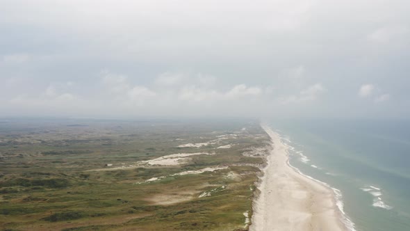 Drone Over Landscape With Beach And Blue Sea