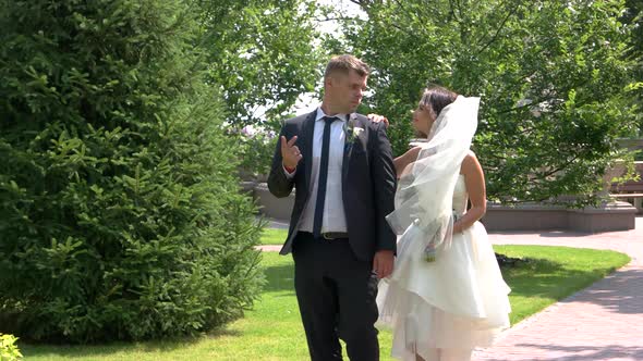 Bride and Groom in Park.