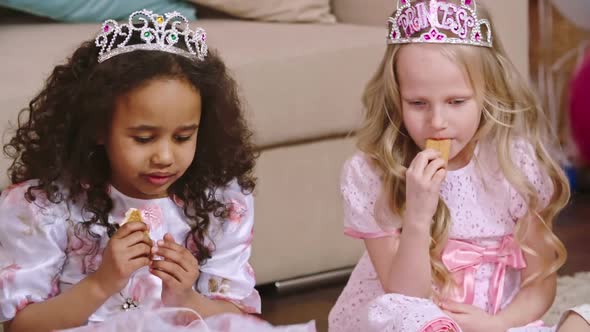 Two Cuties Eating Cookies