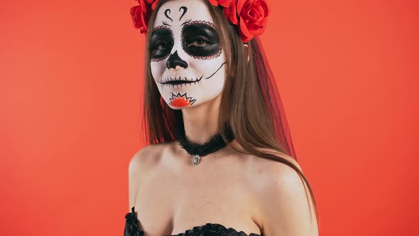 Day of Dead Female with Skull Makeup Looking at you Smiling Beckoning By Hand to Come with Her