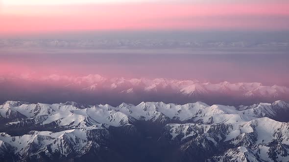 Pink Clouds Over The Mountain Range