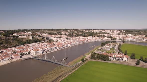 River Sado and cityscape of beautiful town Alcacer Do Sal in Portugal, aerial view