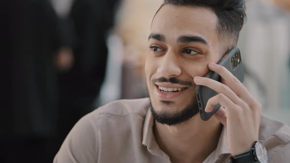 Portrait of Happy Laughing Young Arabic Man Talking on Mobile Phone Friendly Carefree Guy Answering