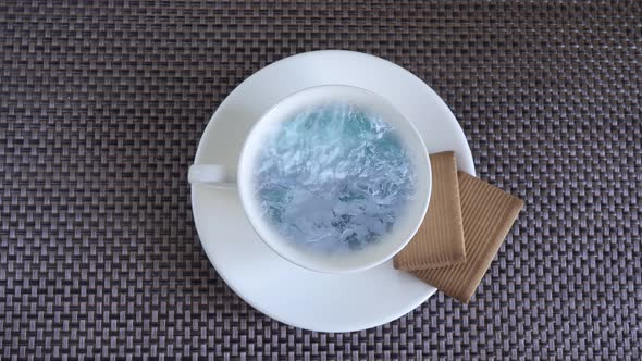 Sea Waves in a Cup