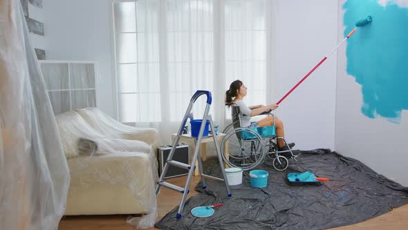 Paralyzed Woman Painting Wall