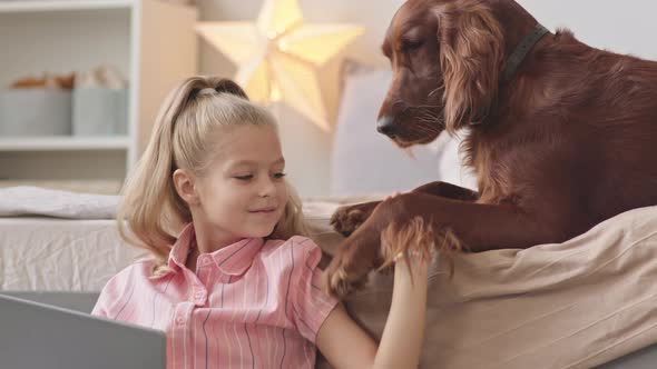 Girl with Dog at Home