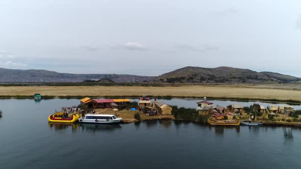 Right travelling movement of drone. Uros Floating Islands over Titicaca lake, Peru