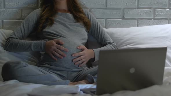 Pregnant Woman Putting Headphones on Tummy, Baby Development, Motherhood