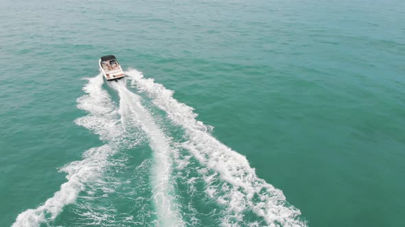 Holidaymakers Riding Motorboats at Poniente Beach on the Costa Blanca in Spain