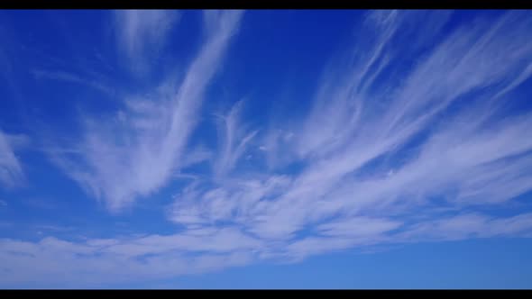 Aerial flying over travel of relaxing shore beach lifestyle by transparent sea with white sand backg