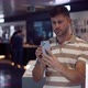 Man Choosing Smartphone in Modern Shop - VideoHive Item for Sale