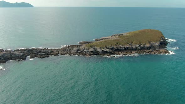 Orbiting around La Ballena de Oriñón, rock formation Island in Cantabria. Spain