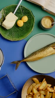 Vertical Flat Lay Video Chef Puts Plate with Crispy Potato Wedges to the Products on the Table