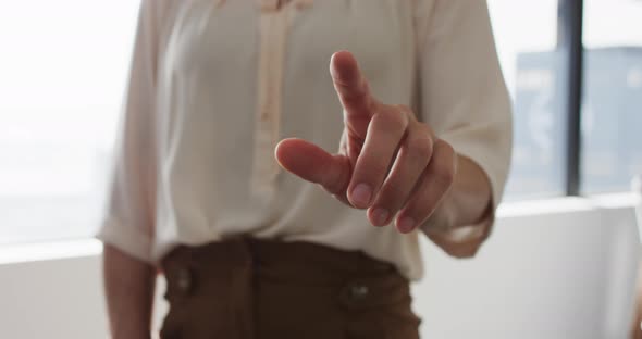 Hand of caucasian businesswoman pointing something in front of her